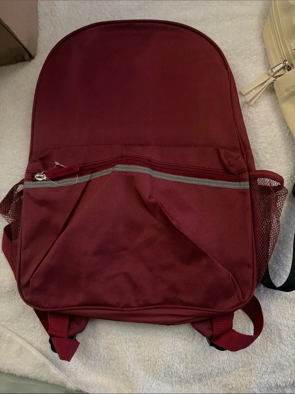 Beige and Burgundy Two Backpacks